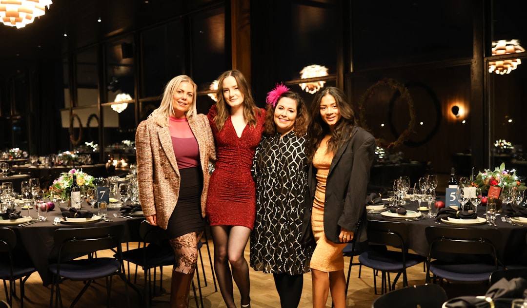 Guests dressed up for a formal murder mystery dinner event
