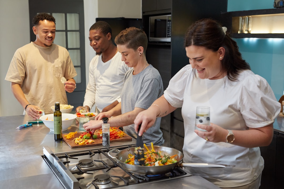 A group preparing a meal together during a team cooking class