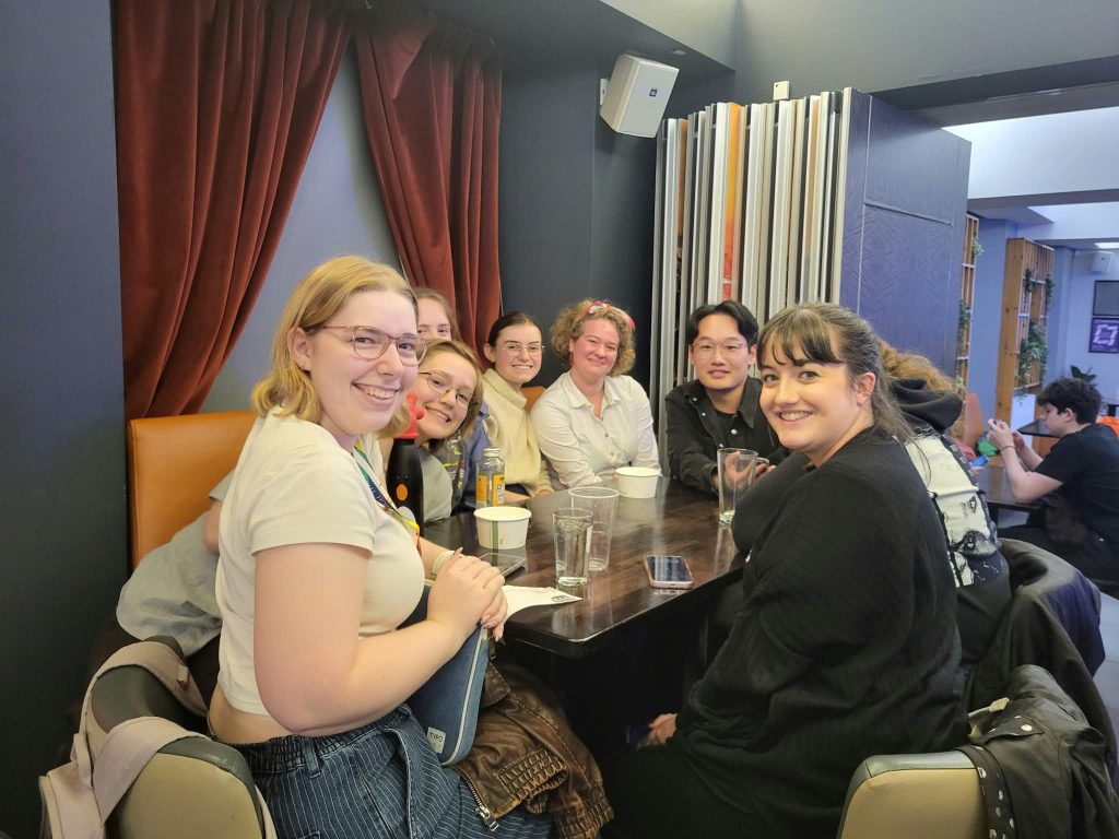 Third-place team Tequila Mockingbird round a table at Premier SpeedQuizzing's quiz night at The Pleasance Café & Bar, Edinburgh